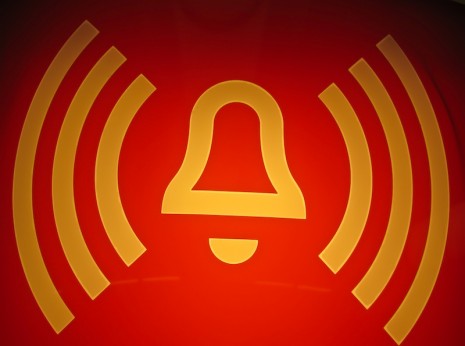 danger bell danger bell in yellow on red background